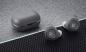 Preview: Bang & Olufsen Beoplay E8 2.0 Earbuds und Ladeschale mit Hintergrund